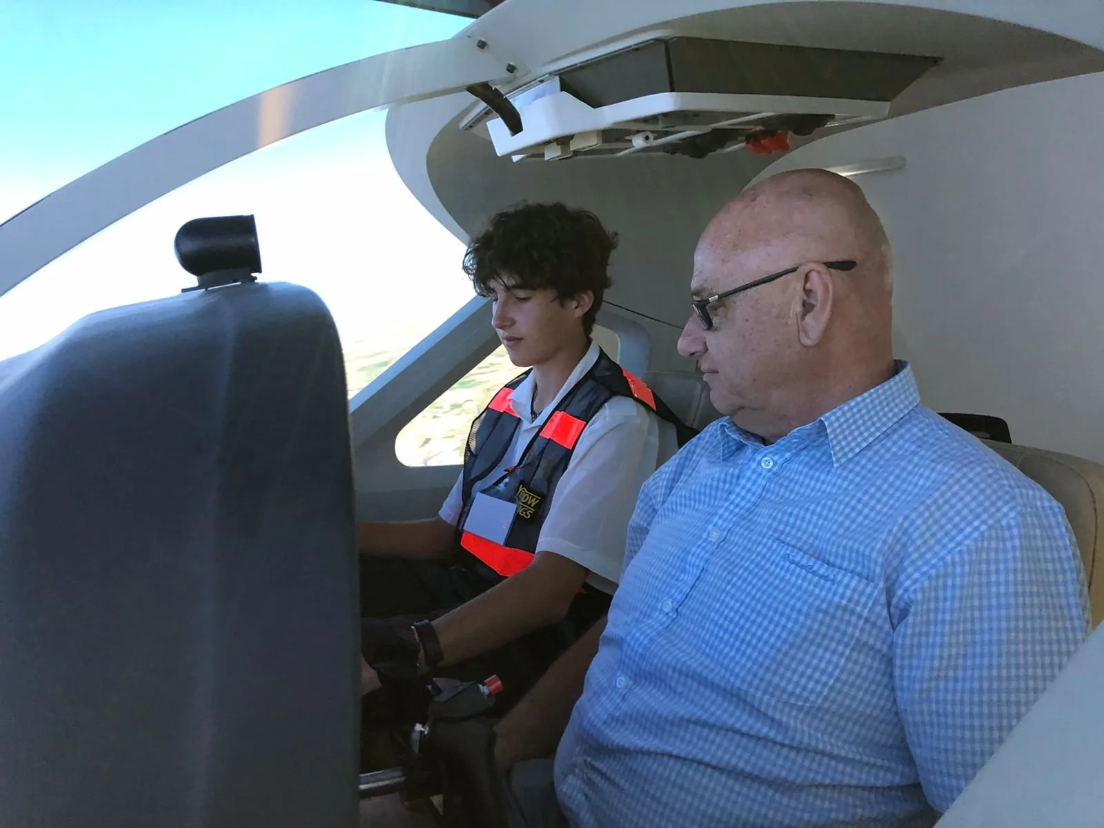 Max in the simulator's left seat, Christian Strebel beside him, 2022