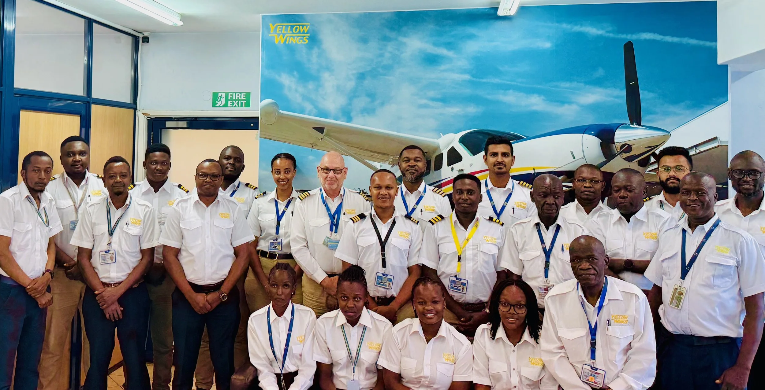 The whole Yellow Wings team together in the office.