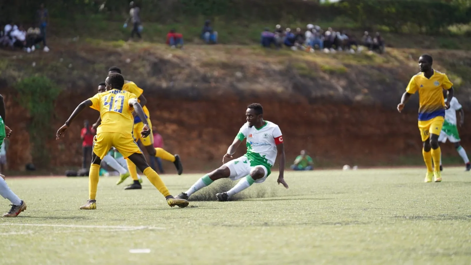 Kibra United: into the tackle.