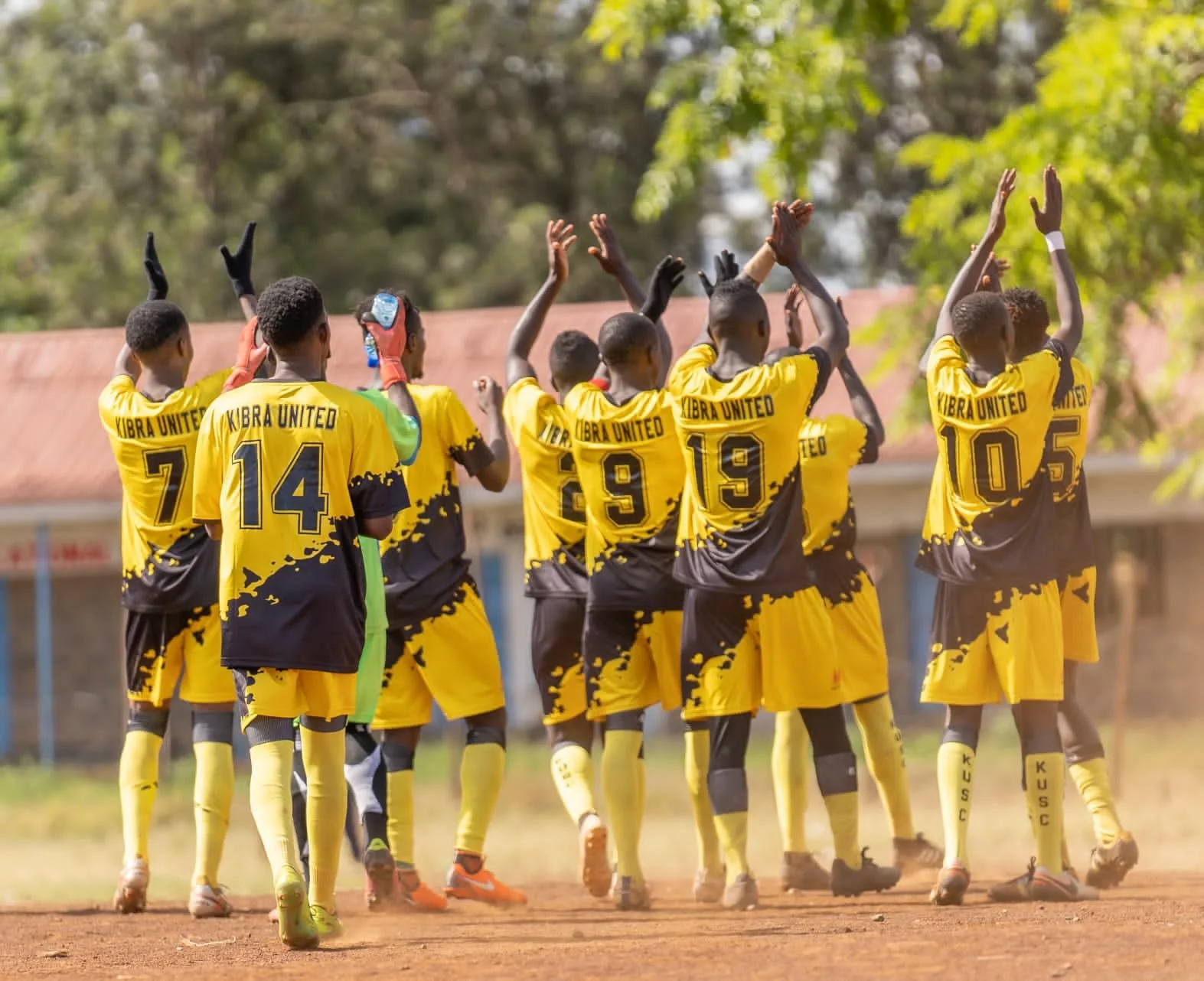 Kibra United: arms up.