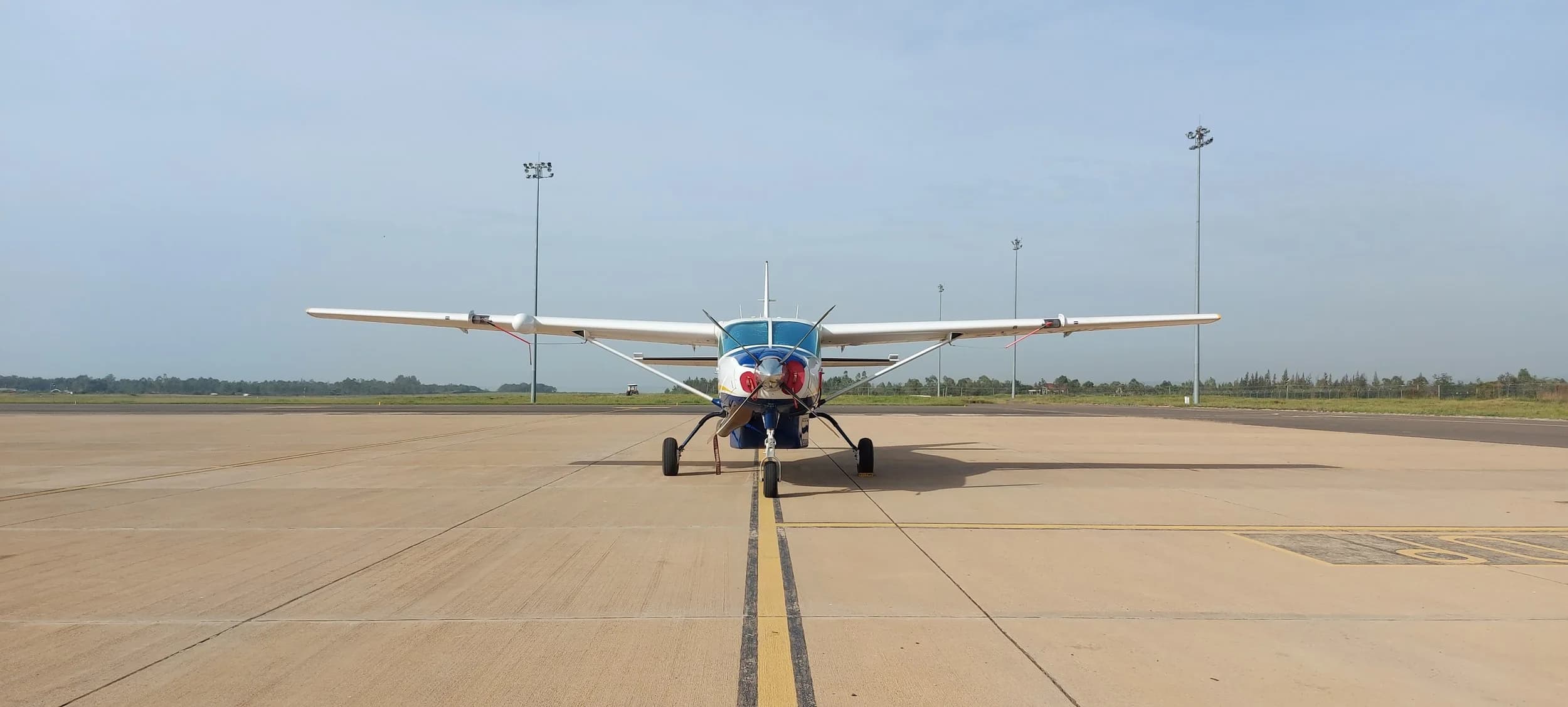 A Caravan nose-on on the centreline of a wide apron