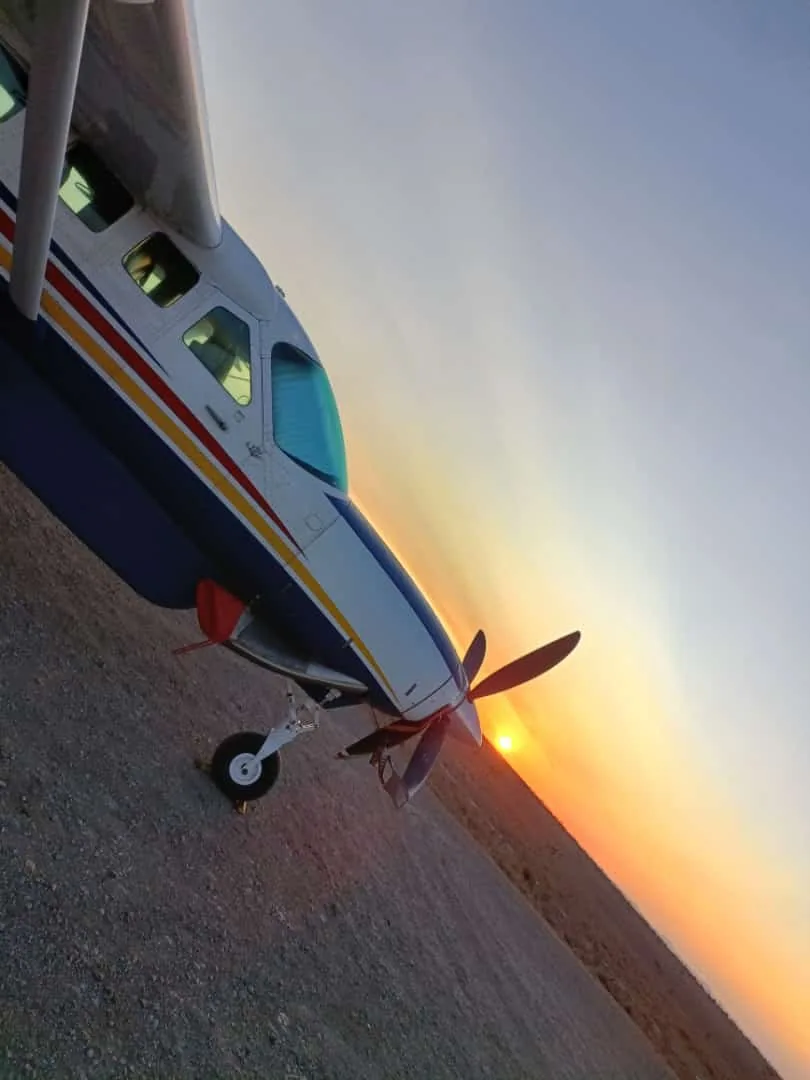 A Caravan's wing and propeller at sunrise
