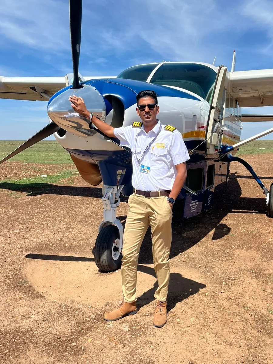Captain Karan Dhanjal beside a Caravan