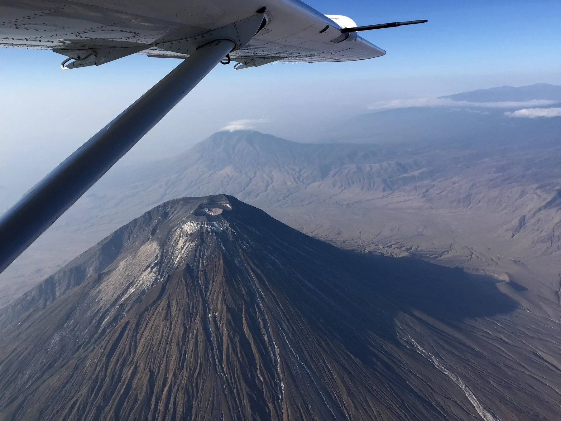 Ol Doinyo Lengai seen from a Yellow Wings Caravan