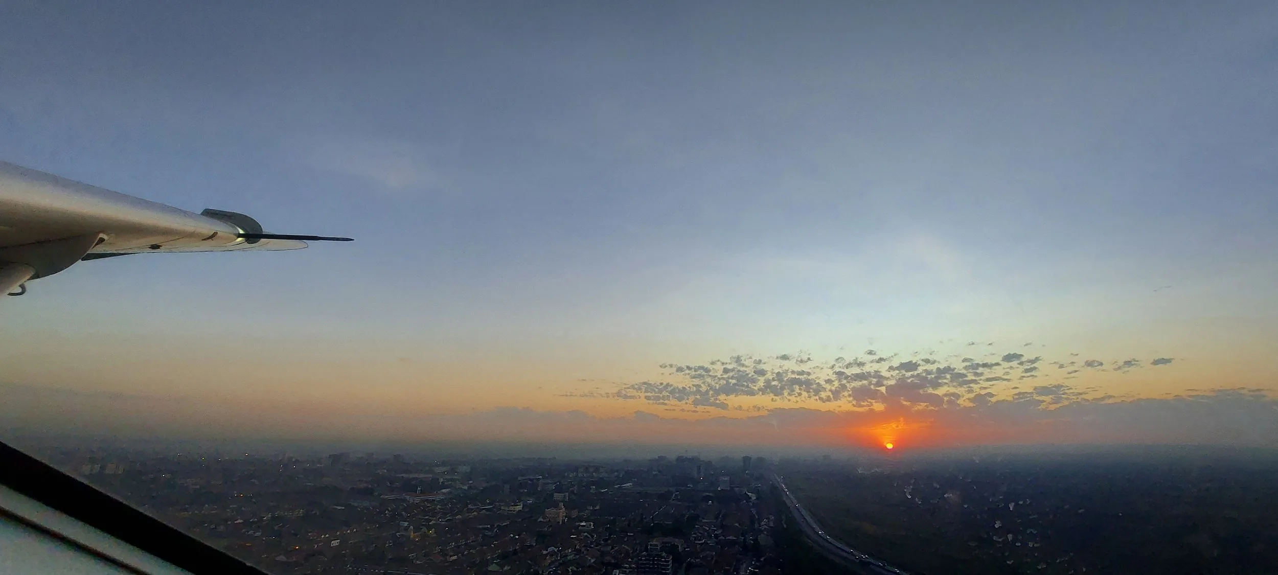 Sunrise over Nairobi from a Caravan climbing out of Wilson